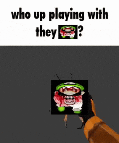 a person is holding a cube with a picture of a cartoon character on it and asking who up playing with they ?