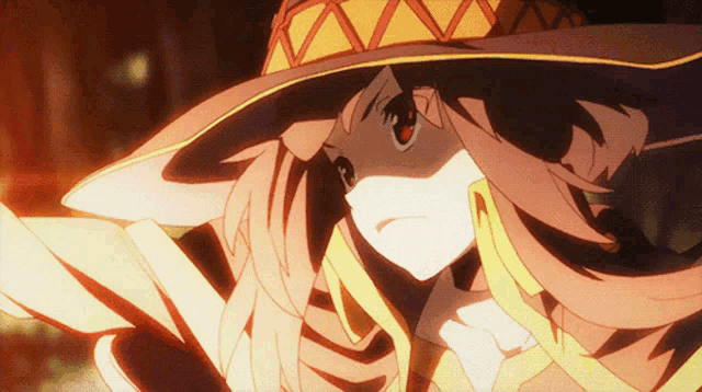a close up of a girl wearing a yellow and red hat