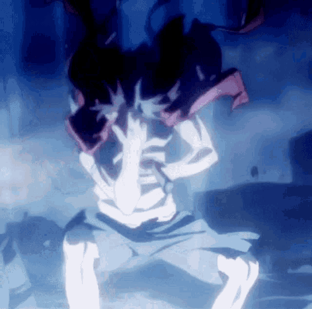 a cartoon character is sitting on the ground with his hands on his face .