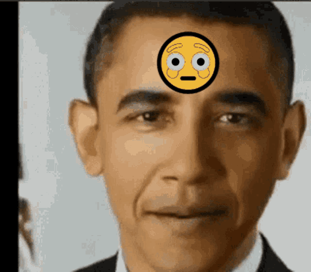 a close up of a man with a smiley face on his forehead