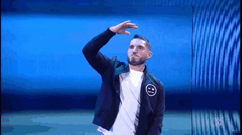 a man with a smiley face on his jacket