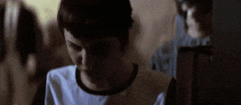 a close up of a person 's face with a blurry background .