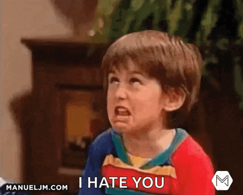 a young boy is making an angry face and saying i hate you