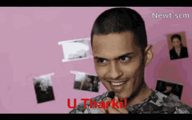 a man is smiling and holding a makeup brush with the words u tharki written in red