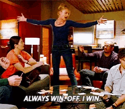 a group of people sitting around a table with the words always win off i win on the table