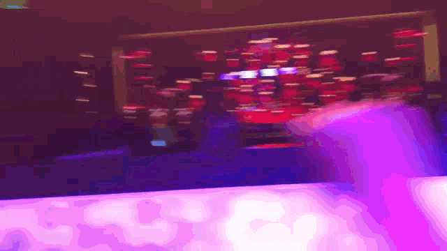 a blurry picture of a stage with a purple light behind it