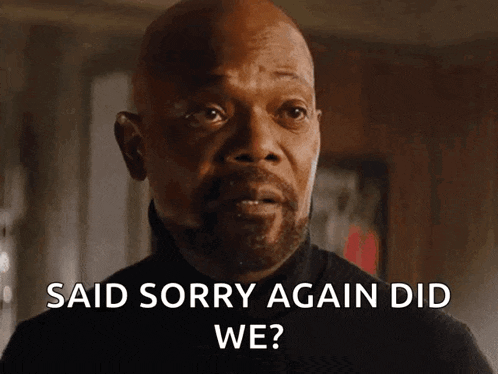 a man says " said sorry again did we " in front of his face