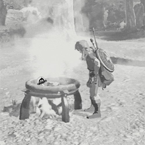 a black and white photo of a person looking at a fire pit