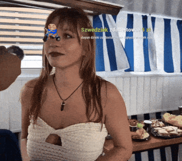 a woman in a white top has a sticker on her head that says szwedzkik zdone towal 5 zł