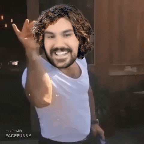 a man with curly hair and a beard is wearing a white shirt and making a funny face .