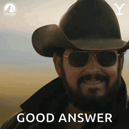 a man in a cowboy hat and sunglasses says " good answer "