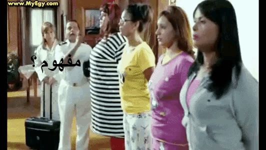 a group of people standing in a line with the website www.myegy.com on the bottom right