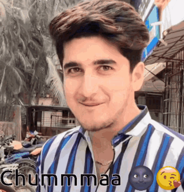 a man wearing a blue and white striped shirt with the word chummaa on the bottom right