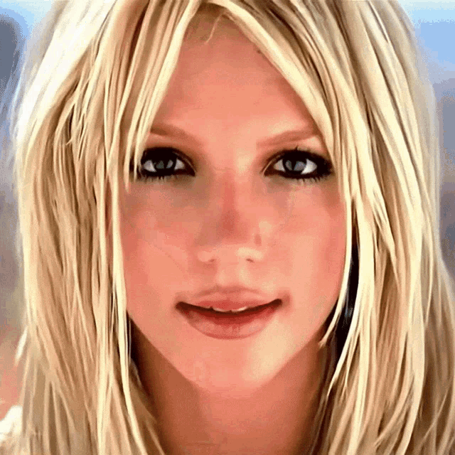 a close up of a blonde woman 's face with blue eyes