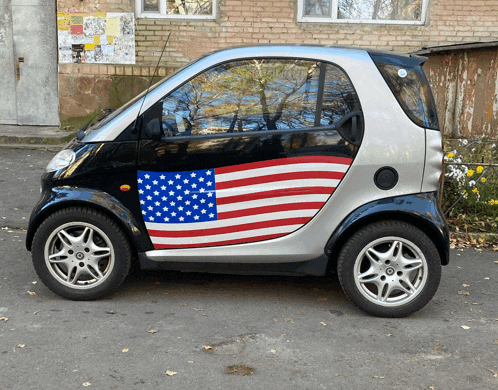 a small car with an american flag on the side