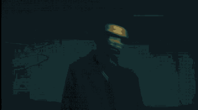 a blurry photo of a person 's face in a dark room