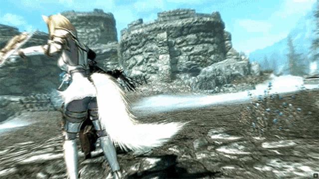 a woman with a white tail is standing in front of a mountain