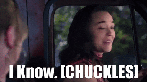 a woman in a car says " i know i chuckle "