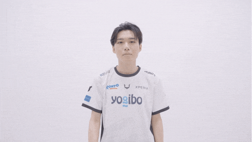 a young man wearing a shirt that says yogibo