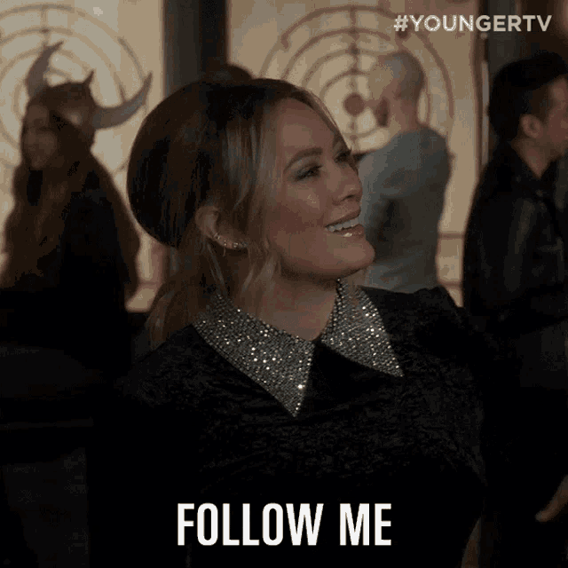 a woman says follow me while standing in front of a target