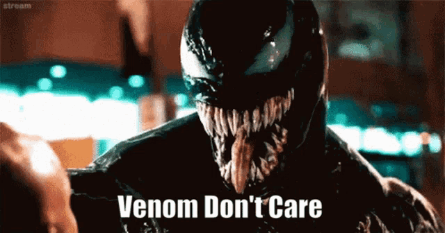 a close up of venom 's face with the words venom don 't care above it