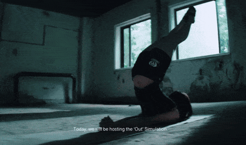 a woman is doing a handstand in a dark room with the words today we will be hosting the out simulation below her