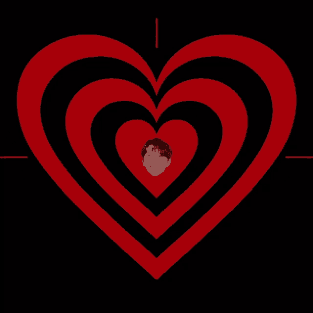 a red and black heart with a picture of a man in the center