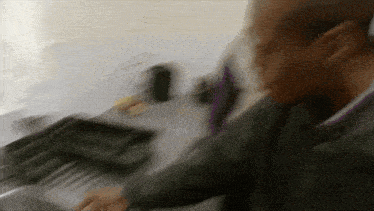 a blurry picture of a person playing a piano