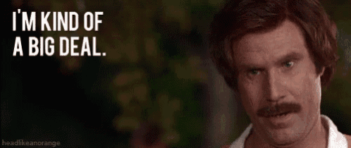 a man with a mustache is making a face and saying `` i 'm kind of a big deal '' .
