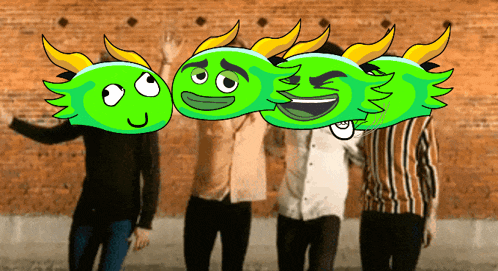 a group of people standing in front of a brick wall with green faces on their faces