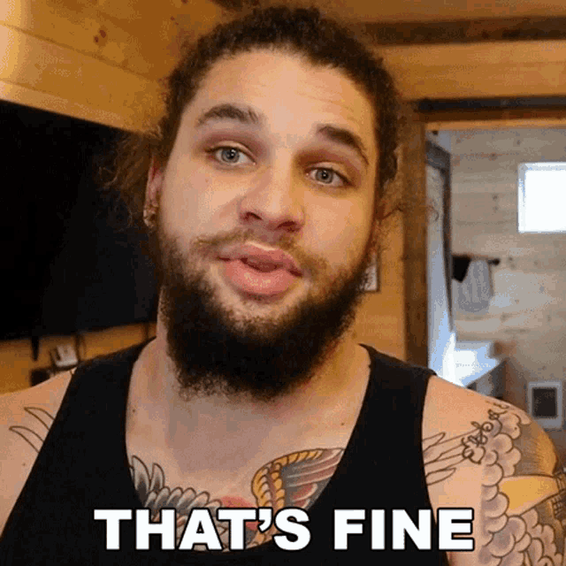a man with a beard and tattoos has the words that 's fine below him