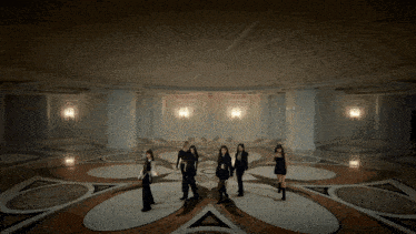 a group of women are dancing in a room
