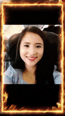a picture of a woman with a fire frame around her face