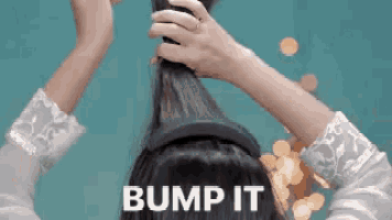 a woman wearing a headband with the words " bump it " on the bottom