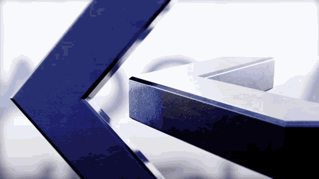 a close up of a blue and silver arrow pointing to the right