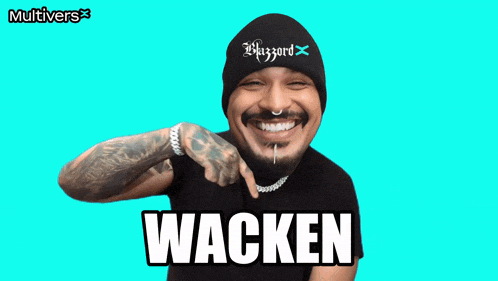 a man wearing a black beanie and a black shirt with the word wacken on it