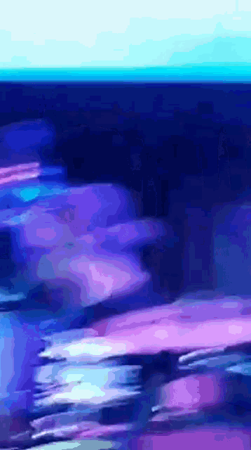 a blurry picture of a blue and purple colored background