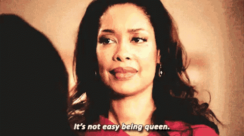 a woman says it 's not easy being queen while smiling
