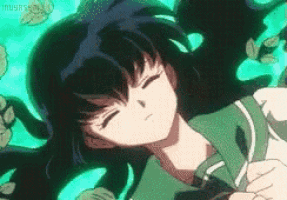 a girl with long black hair is laying on the ground with her eyes closed in a cartoon .