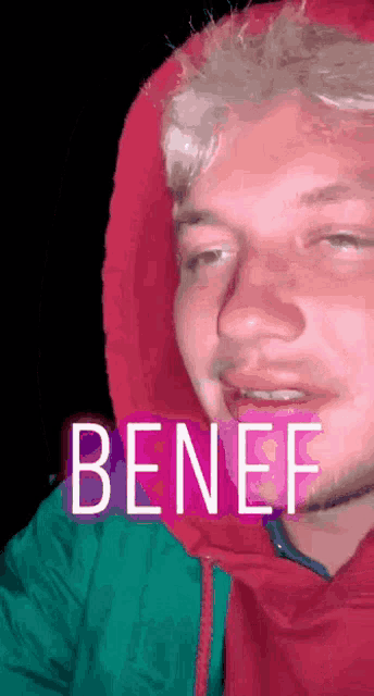 a man wearing a red hooded jacket with the word benef on the bottom