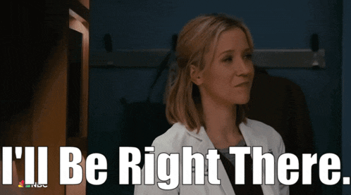 a woman in a lab coat with the words " i 'll be right there " above her