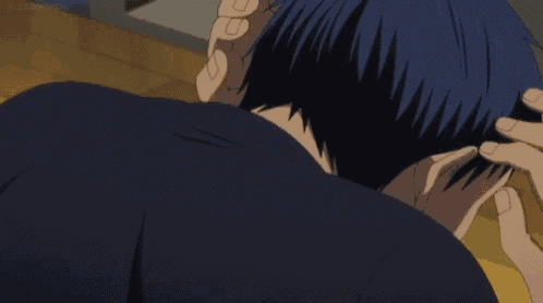 a man in a black shirt is making a funny face while looking over his shoulder .
