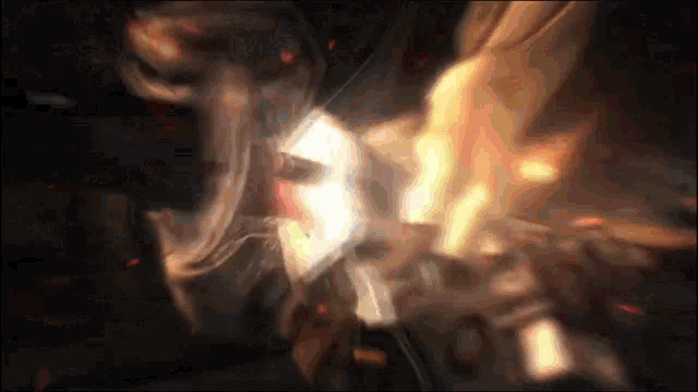 a blurred image of a person in a dark room with a fire coming out of their mouth