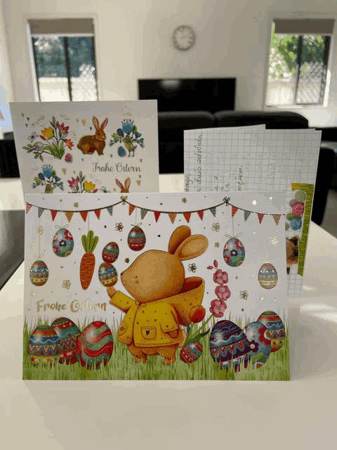 a greeting card that says frohe ostern sits on a table