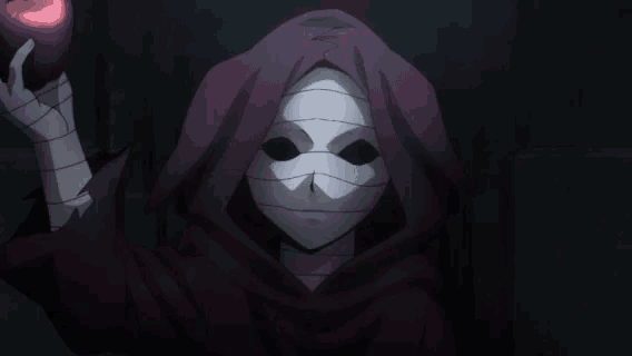 a person with a hood and a mask holding an apple