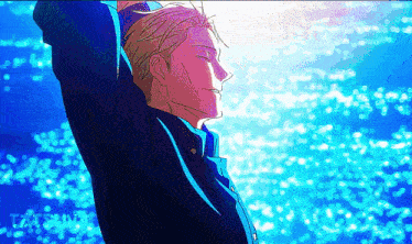 a man with his arms outstretched is standing in front of a body of water .