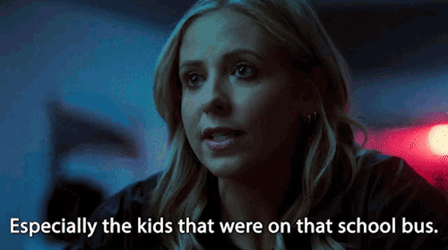 a woman in a dark room with the words especially the kids that were on that school bus