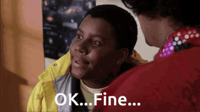 a boy in a yellow jacket is talking to a man in a red jacket and they both say ok fine