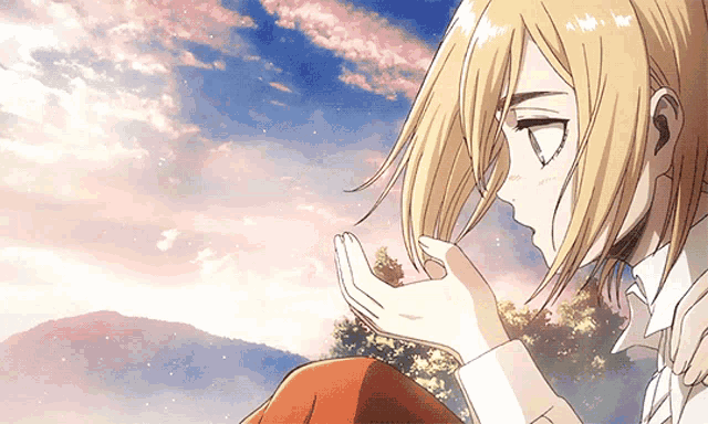 a girl with blonde hair is holding her hand to her face in front of a cloudy sky