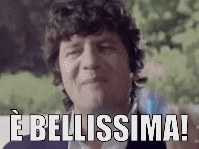 a man with curly hair says e bellissima !